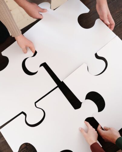 close up photo of people holding puzzle pieces